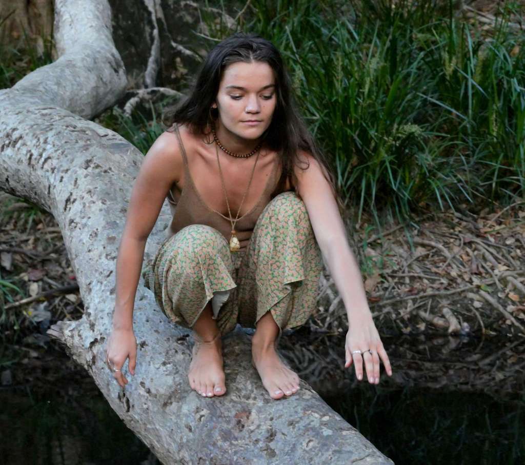 Woman in a moment of trust and vulnerability within a natural environment