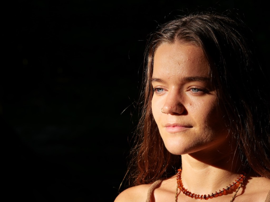 Close-up of woman with eyes closed, expressing calm and inner presence